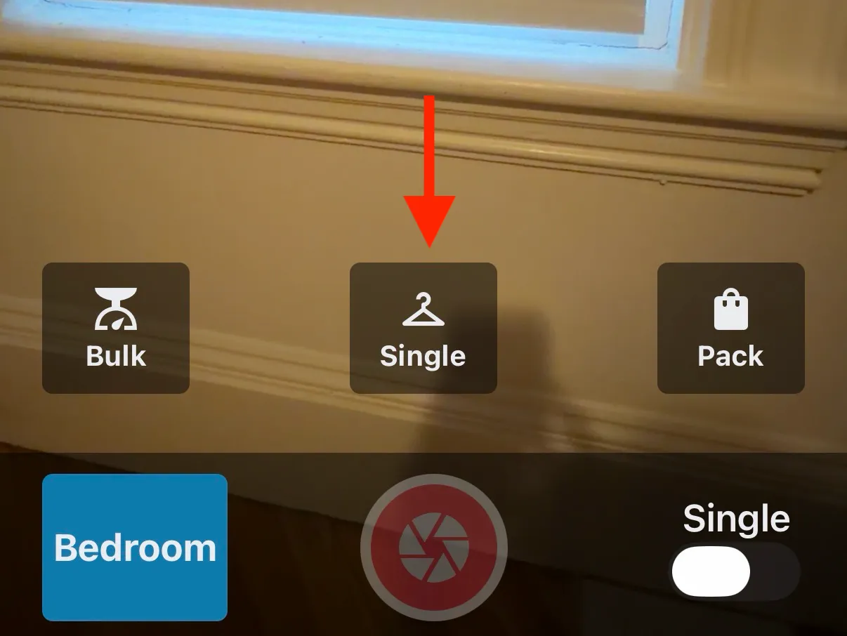 Single button highlighted at bottom of camera screen
